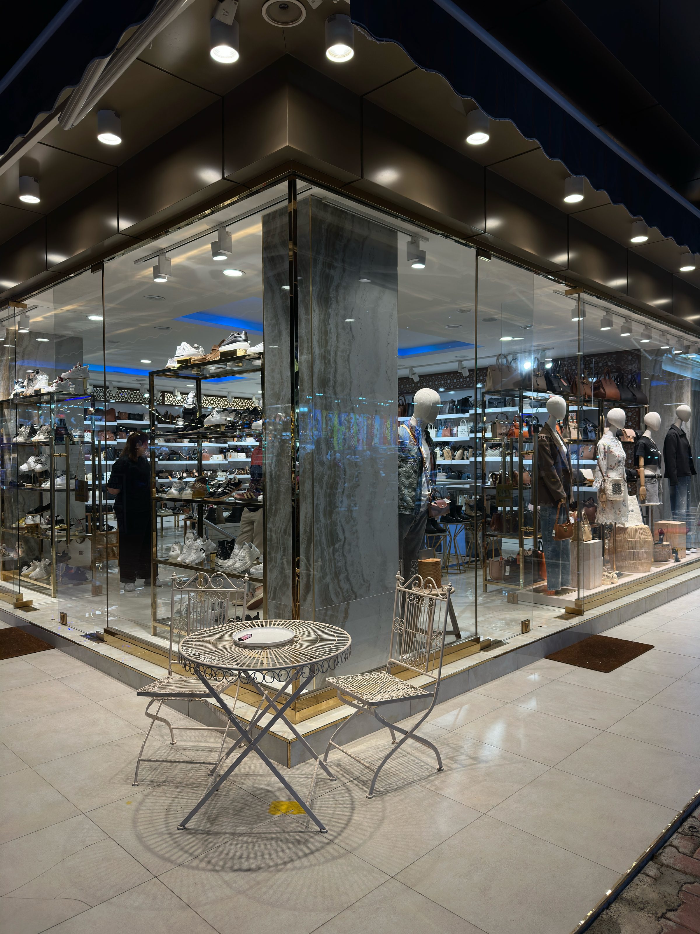 The BROTHERSBAG storefront in Türkler, Alanya, lit at night